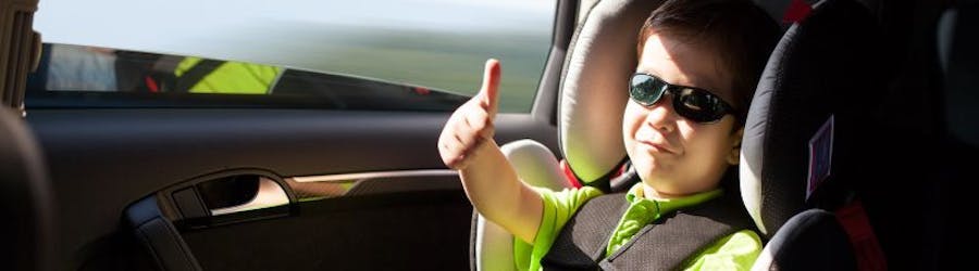 Photo of toddler in a car seat