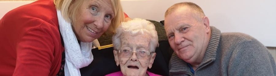 Photo of care home resident and her family