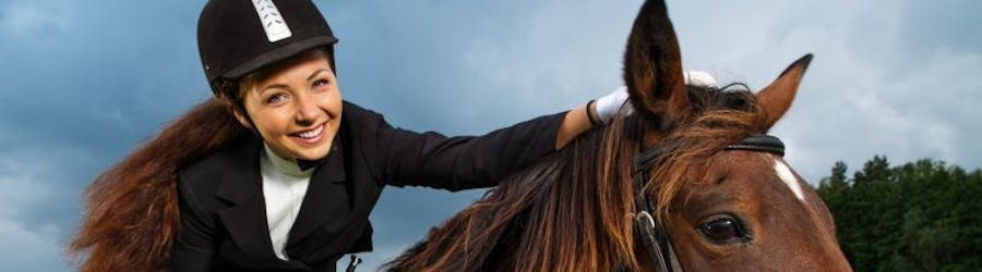 Photo of a young girl on horseback