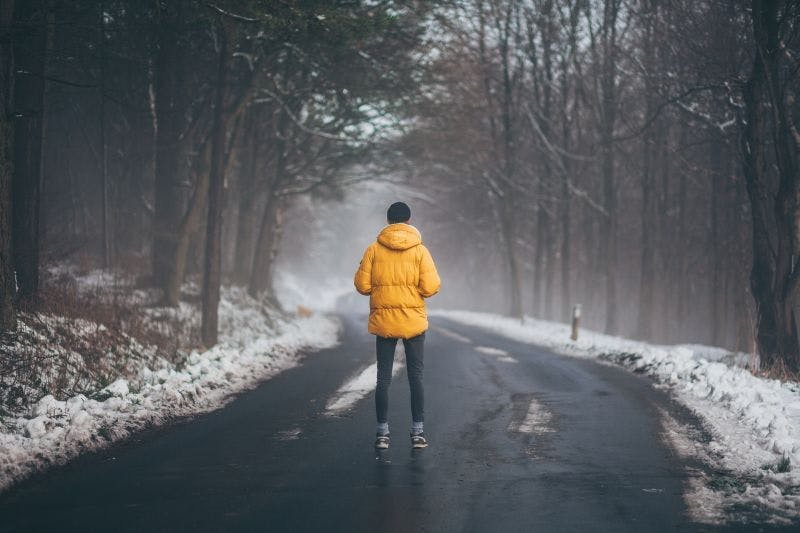 Photo of a man on an empty road