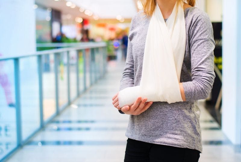 Woman shopper with arm injury