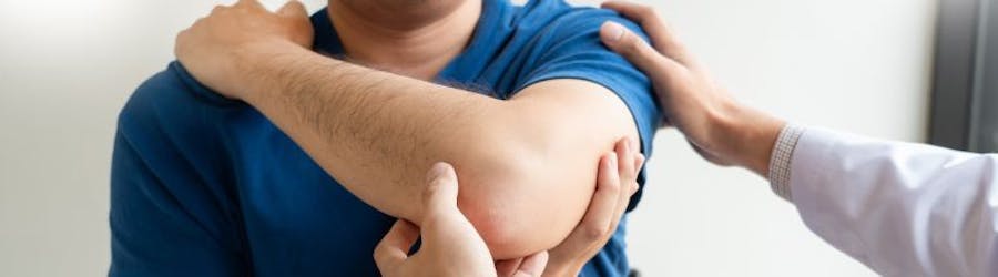 man having physiotherapy on his shoulder